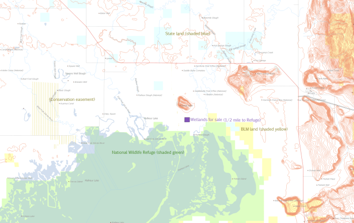 1/2 mile to the Refuge, just south of Saddle Butte, and in an excellent riparian area.
